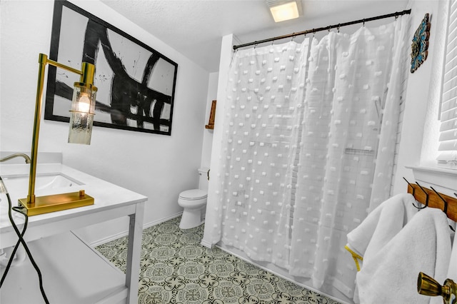 bathroom with vanity, a shower with shower curtain, a textured ceiling, and toilet