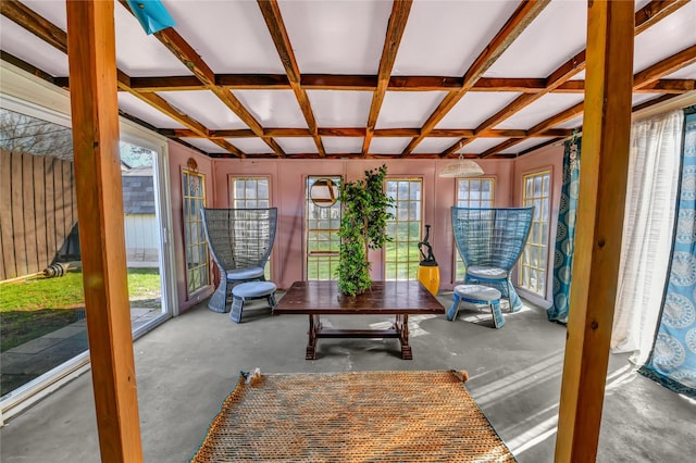 sunroom with beam ceiling, plenty of natural light, and coffered ceiling