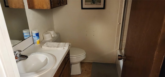 bathroom with toilet and vanity