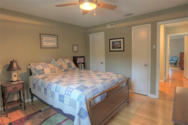 bedroom featuring ceiling fan and light hardwood / wood-style floors