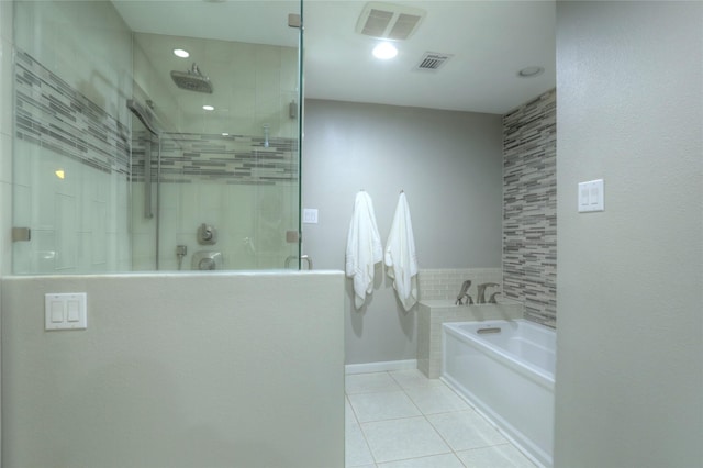 bathroom featuring tile patterned flooring, shower with separate bathtub, and tile walls