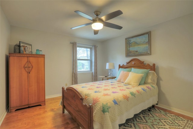 bedroom featuring hardwood / wood-style flooring and ceiling fan