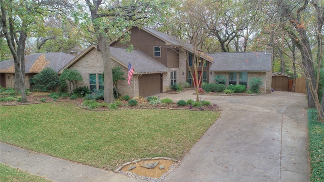 view of front facade with a garage and a front lawn