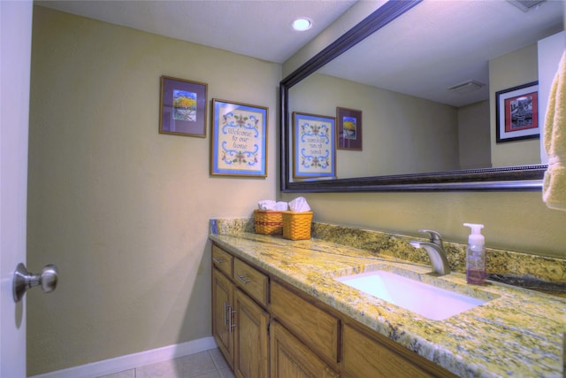 bathroom featuring tile patterned flooring and vanity