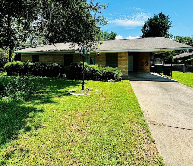 single story home with a carport and a front yard