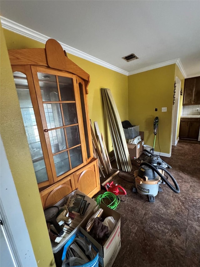 interior space with crown molding