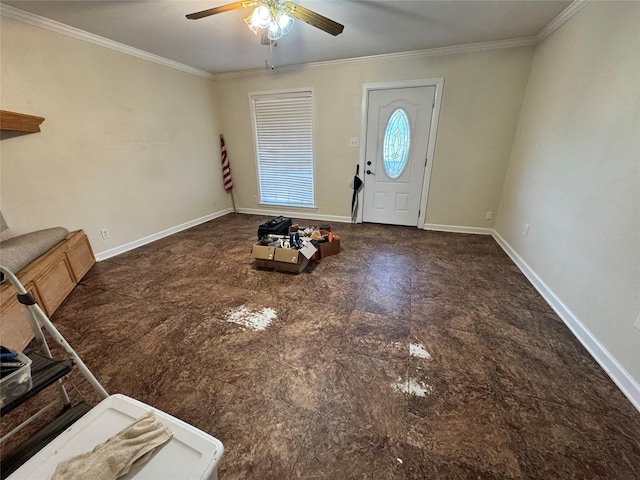 entrance foyer with ceiling fan and ornamental molding