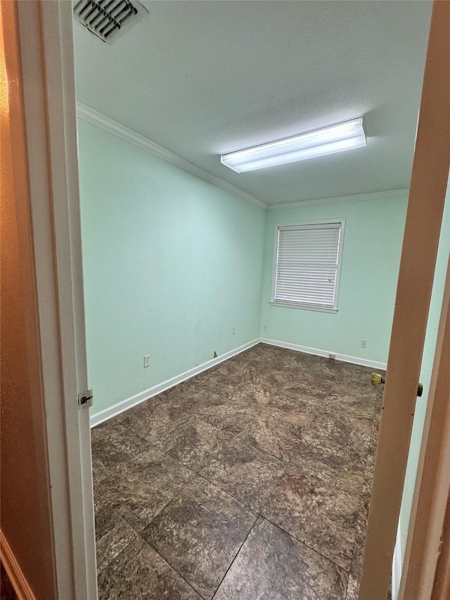 spare room featuring ornamental molding