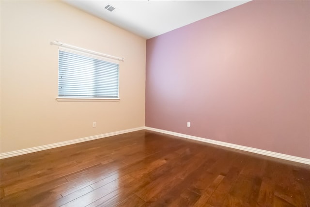 empty room featuring hardwood / wood-style floors