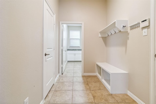 mudroom with light tile patterned floors