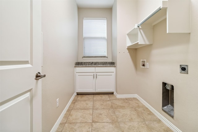 washroom featuring hookup for a washing machine, light tile patterned floors, and electric dryer hookup