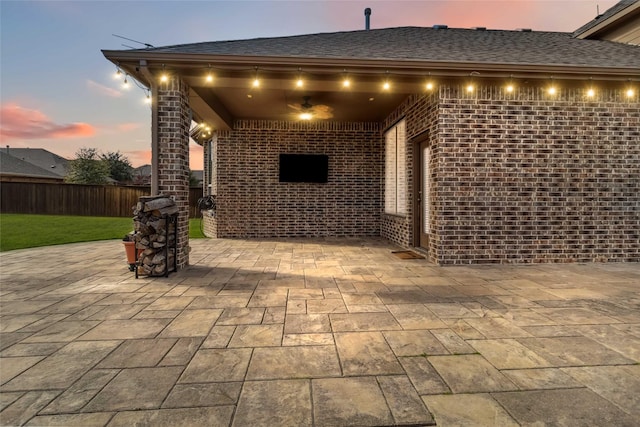 view of patio terrace at dusk