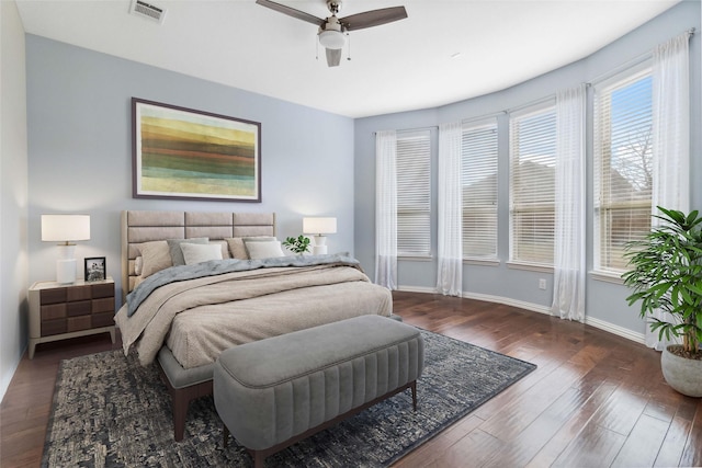 bedroom featuring dark hardwood / wood-style flooring and ceiling fan