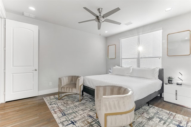 bedroom featuring wood-type flooring and ceiling fan