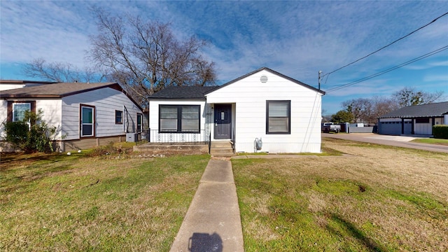 bungalow-style house with a front yard