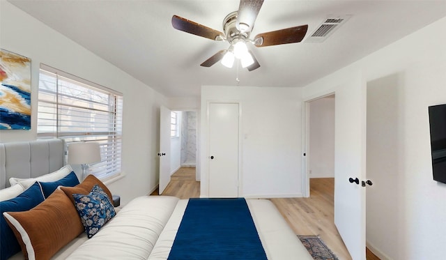 bedroom featuring ceiling fan and light hardwood / wood-style flooring