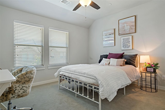 carpeted bedroom featuring vaulted ceiling and ceiling fan