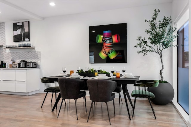 dining area with light hardwood / wood-style floors