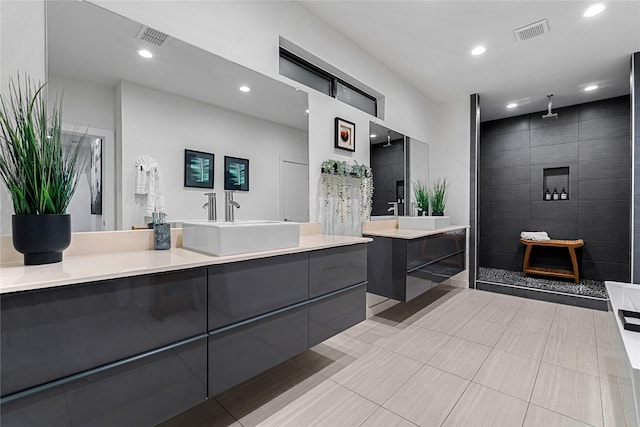 bathroom featuring vanity, tile patterned floors, and independent shower and bath