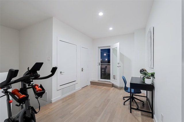 office space with light wood-type flooring