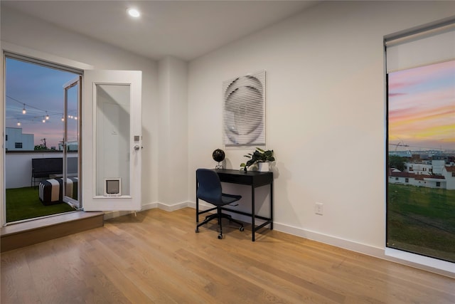 office area with light hardwood / wood-style flooring