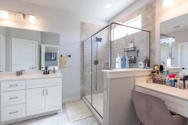 bathroom featuring vanity and an enclosed shower