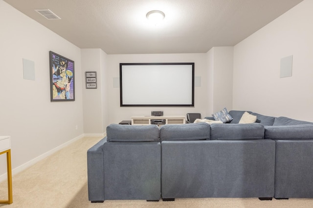 carpeted home theater room with a textured ceiling