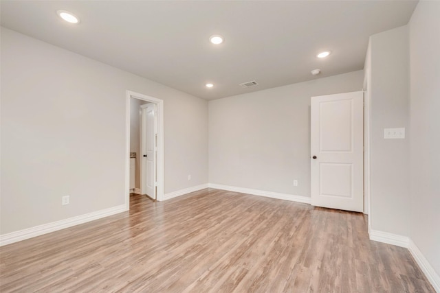 unfurnished room with light hardwood / wood-style flooring