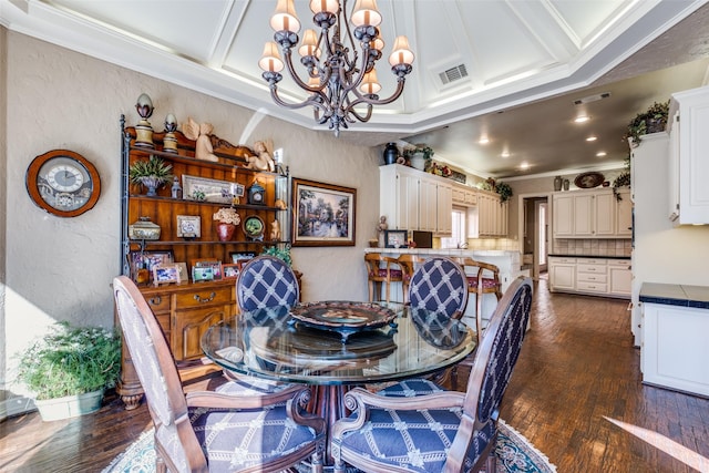 dining space with coffered ceiling, dark wood-type flooring, crown molding, and an inviting chandelier