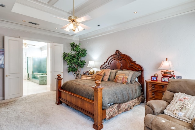 carpeted bedroom featuring ceiling fan, crown molding, connected bathroom, and a tray ceiling