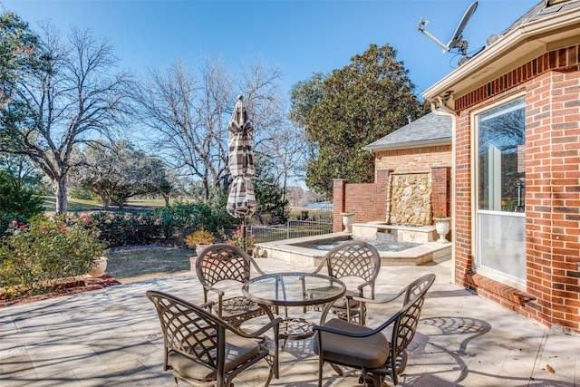 view of patio / terrace with an outdoor fireplace