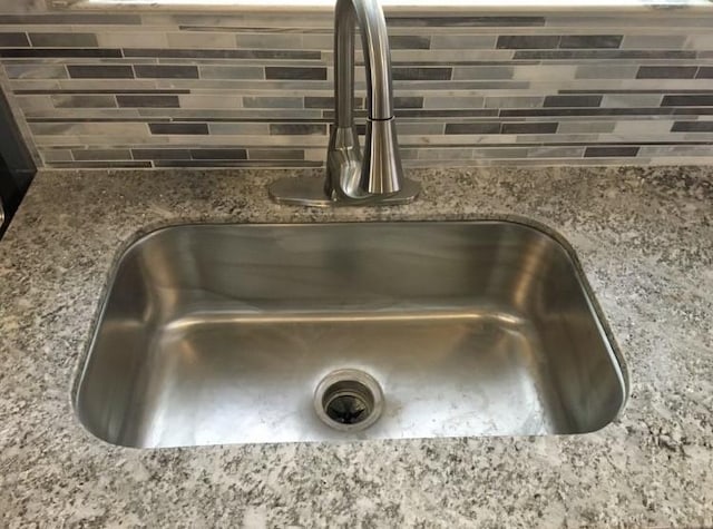 interior details with sink and dark stone counters