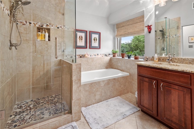 bathroom with tile patterned floors, vanity, and plus walk in shower