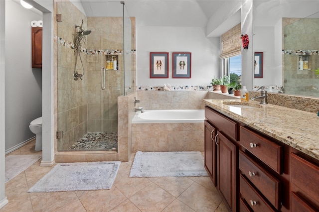 full bathroom with tile patterned floors, vanity, independent shower and bath, and toilet