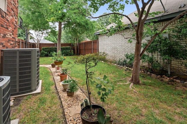 view of yard with central air condition unit