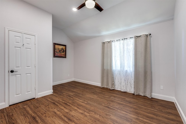 unfurnished room with dark wood-type flooring, ceiling fan, and lofted ceiling