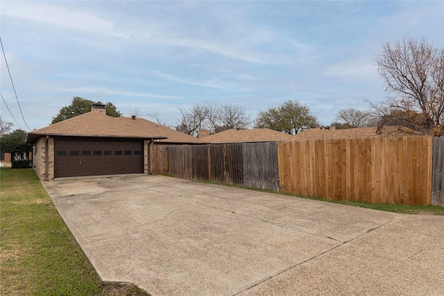 view of property exterior with a garage