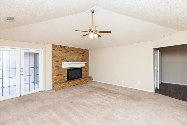 carpeted spare room with ceiling fan and a textured ceiling