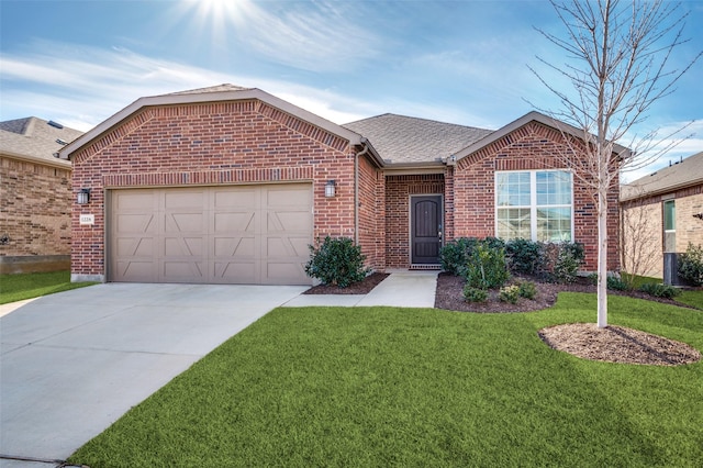 view of front of home with a garage and a front yard