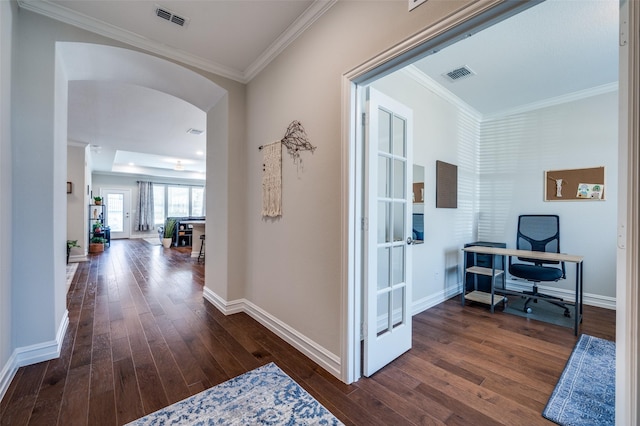 hallway featuring crown molding and dark hardwood / wood-style flooring