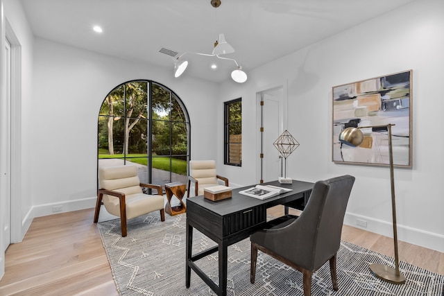 office area with light hardwood / wood-style flooring