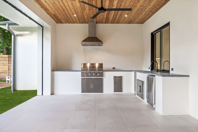 view of patio with grilling area, ceiling fan, sink, and an outdoor kitchen