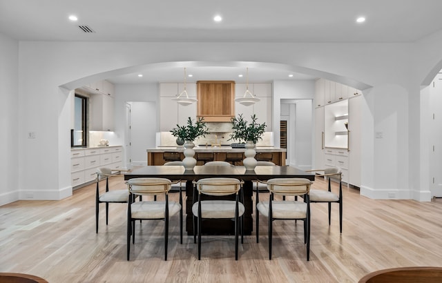 dining area featuring light wood-type flooring