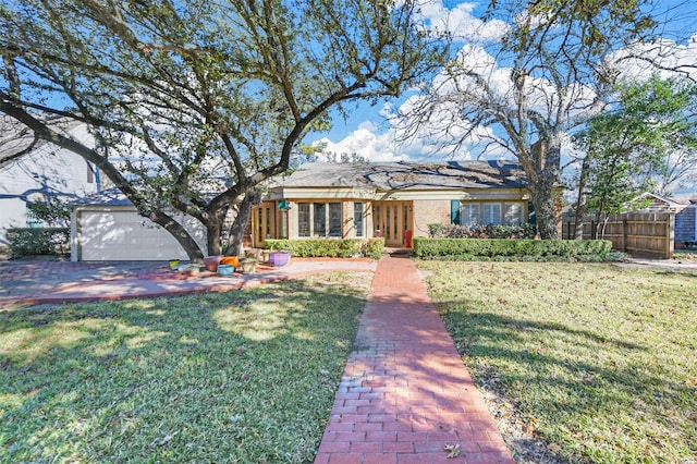 single story home with a front lawn and a garage