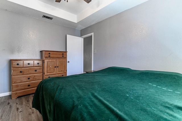 unfurnished bedroom featuring ceiling fan and light hardwood / wood-style flooring