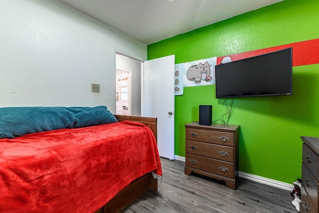 bedroom featuring wood-type flooring