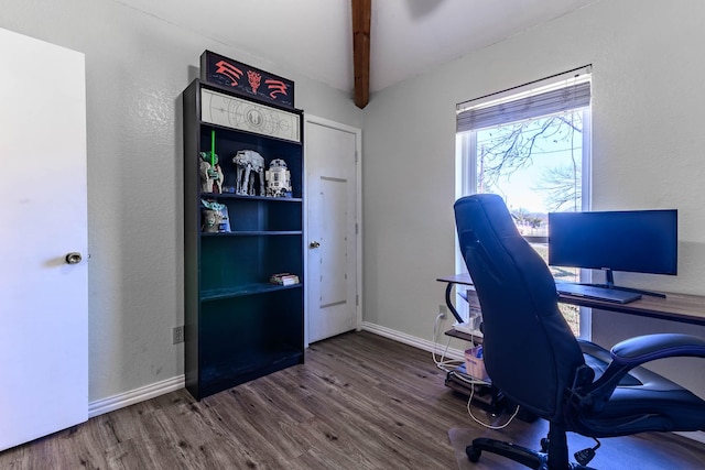 office area with beam ceiling and dark wood-type flooring