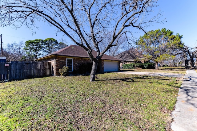 ranch-style home featuring a garage and a front yard