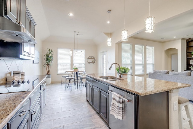 kitchen with sink, dishwasher, dark brown cabinetry, a center island with sink, and decorative light fixtures