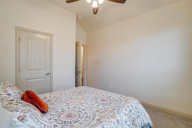 carpeted bedroom featuring ceiling fan and vaulted ceiling